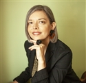 a headshot of writer Becky Lima_Matthews against a green background